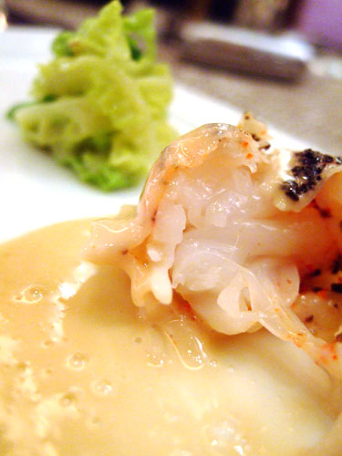 La langoustine, truffée et cuite en ravioli avec un émincé de chou étuvé (truffled langoustine ravioli with stewed cabbage)